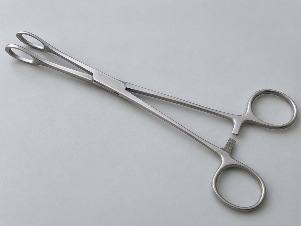 Pinza Foerster in acciaio con ganasce ovali fenestrate e manici ad anello.